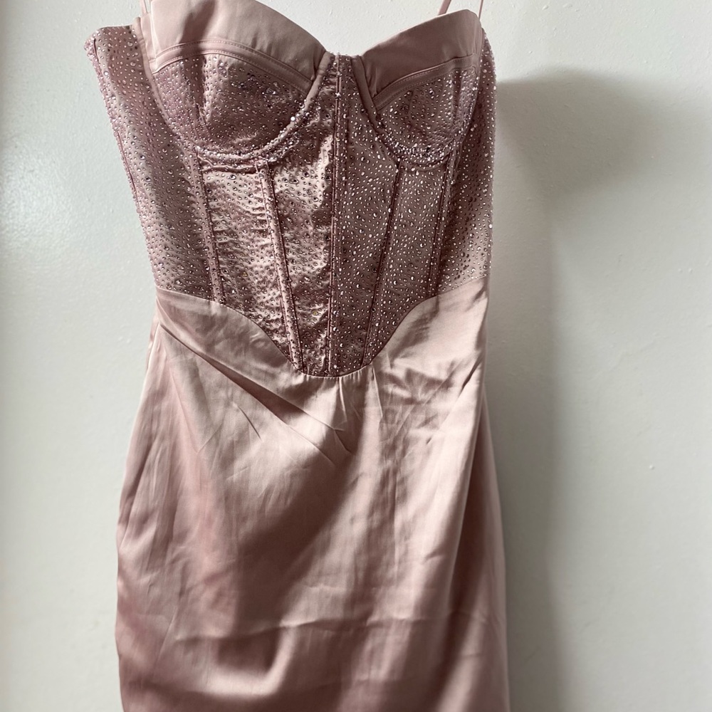 Pink beaded mini dress with spaghetti straps.